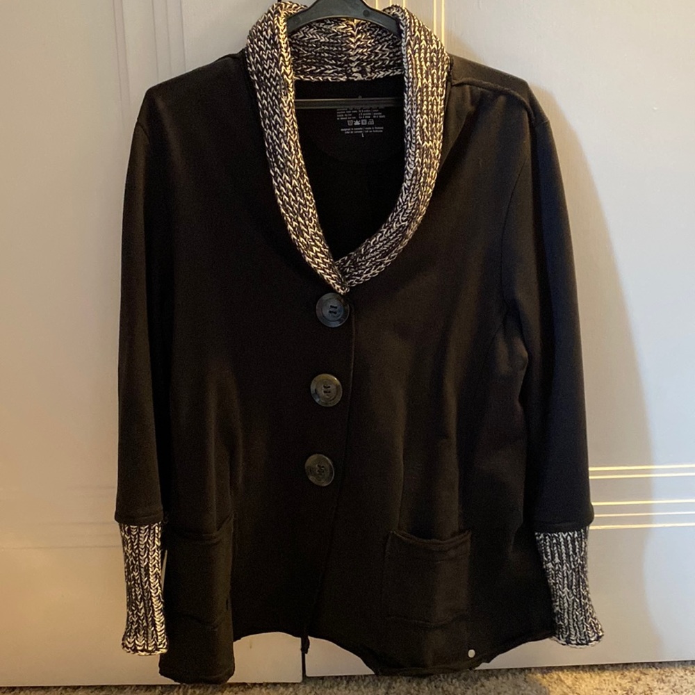Black Neon Buddha jacket with black and white knit collar and cuffs.